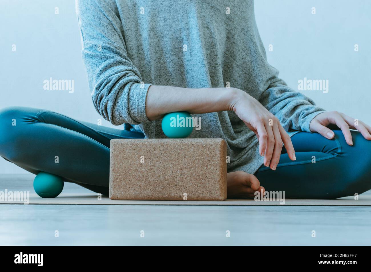 Forearm muscles myofascial release with massage ball on cork block