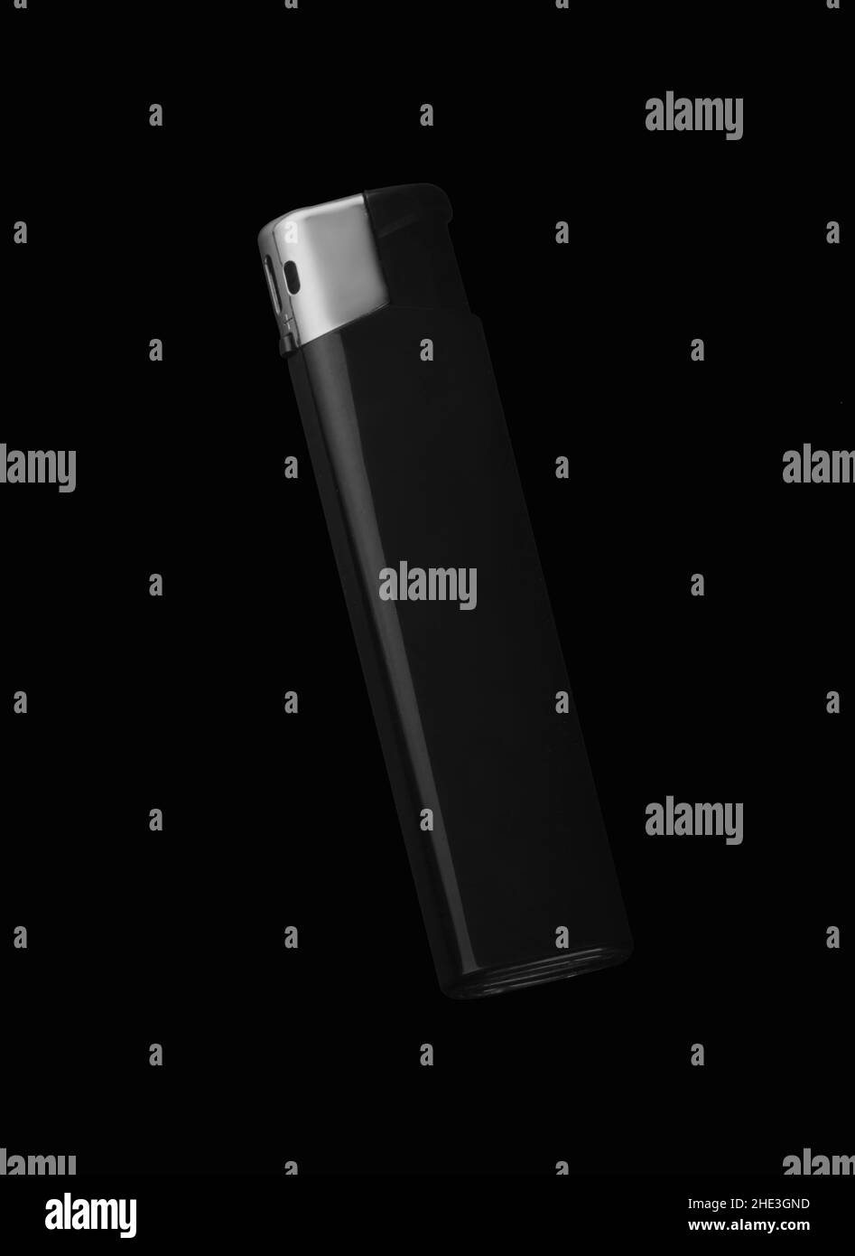 Black lighter on a black background isolated Stock Photo