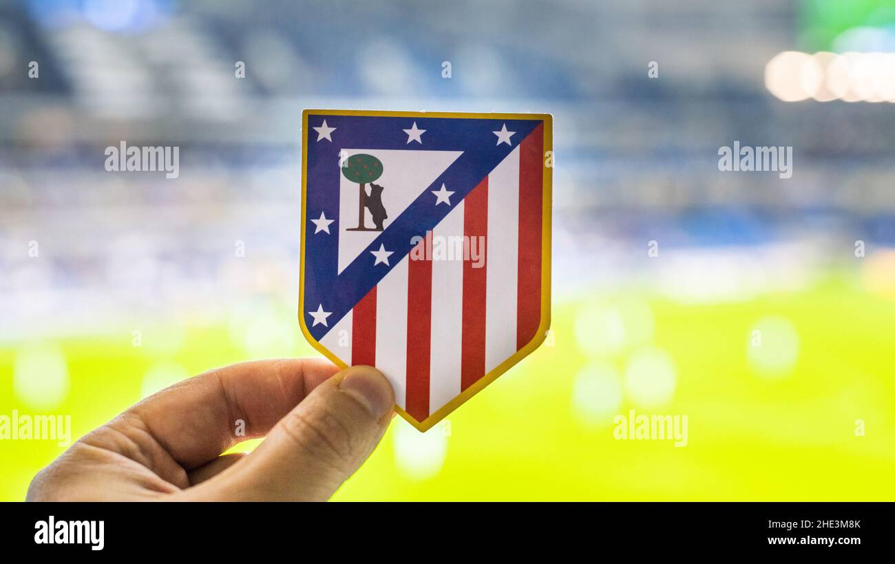 September 12, 2021, Madrid, Spain. The emblem of the football club Atletico Madrid against the background of a modern stadium. Stock Photo
