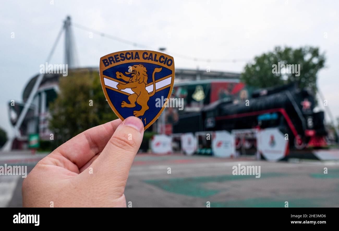 August 30, 2021, Brescia, Italy. The emblem of the football club Brescia Calcio against the background of a modern stadium. Stock Photo
