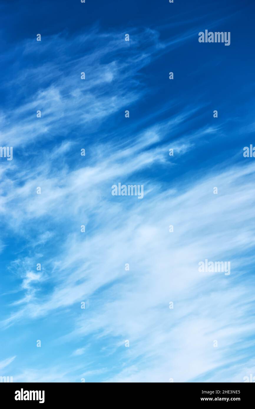 Fast moving clouds in the blue sky - abstract background Stock Photo