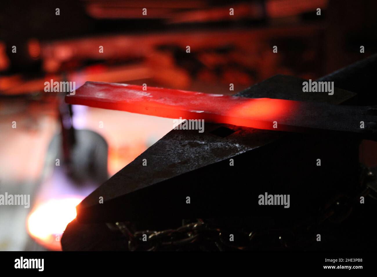 Smiting with local iron steel Blacksmith creating Hammer furnace creating knife sword Stock Photo