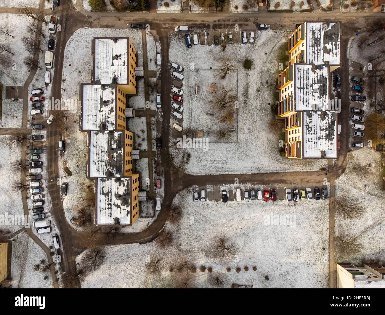 Multi-family houses seen from bird height on a cloudy winter day. Winter. Stock Photo