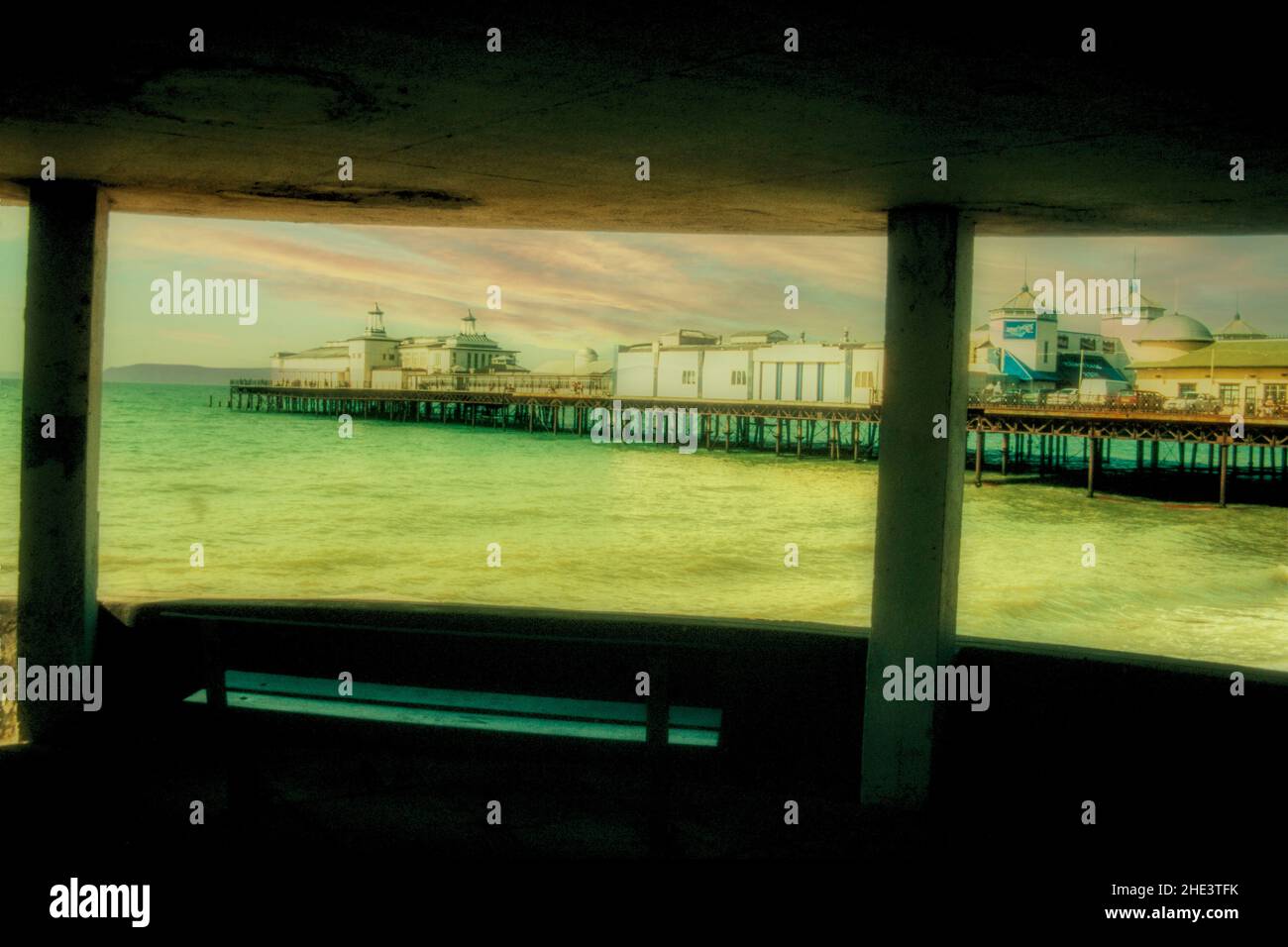 Eastbourne pier through natural frame of concrete windows Stock Photo