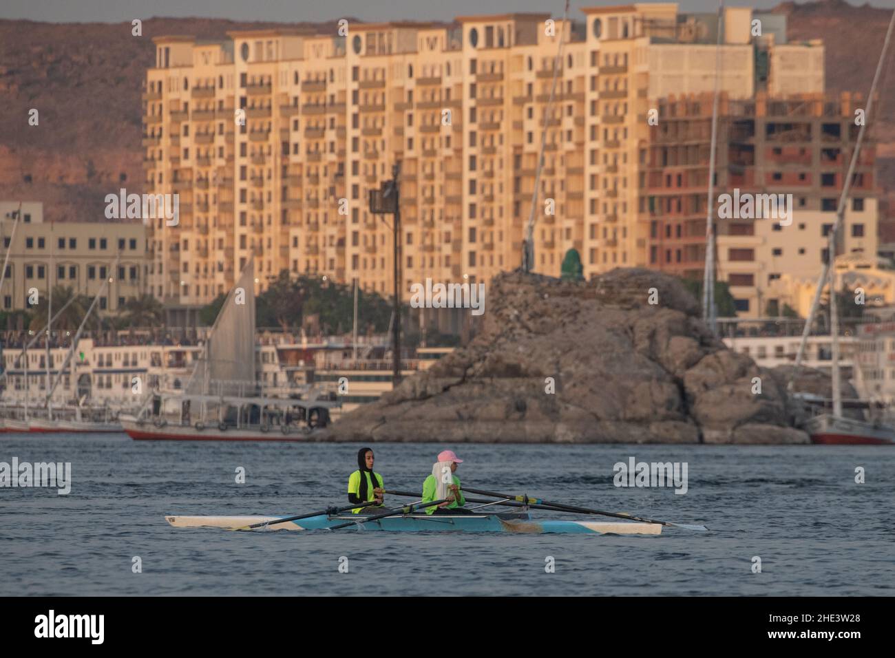 Female rowers training in a double scull on the Nile river in Aswan, Egypt. Stock Photo