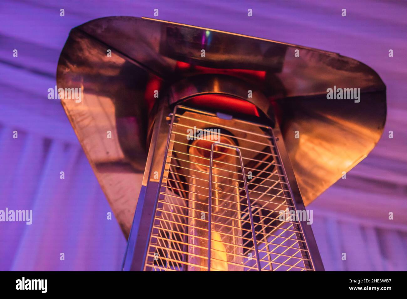 heating lamp heater placed among the tables of an open cafe Stock Photo