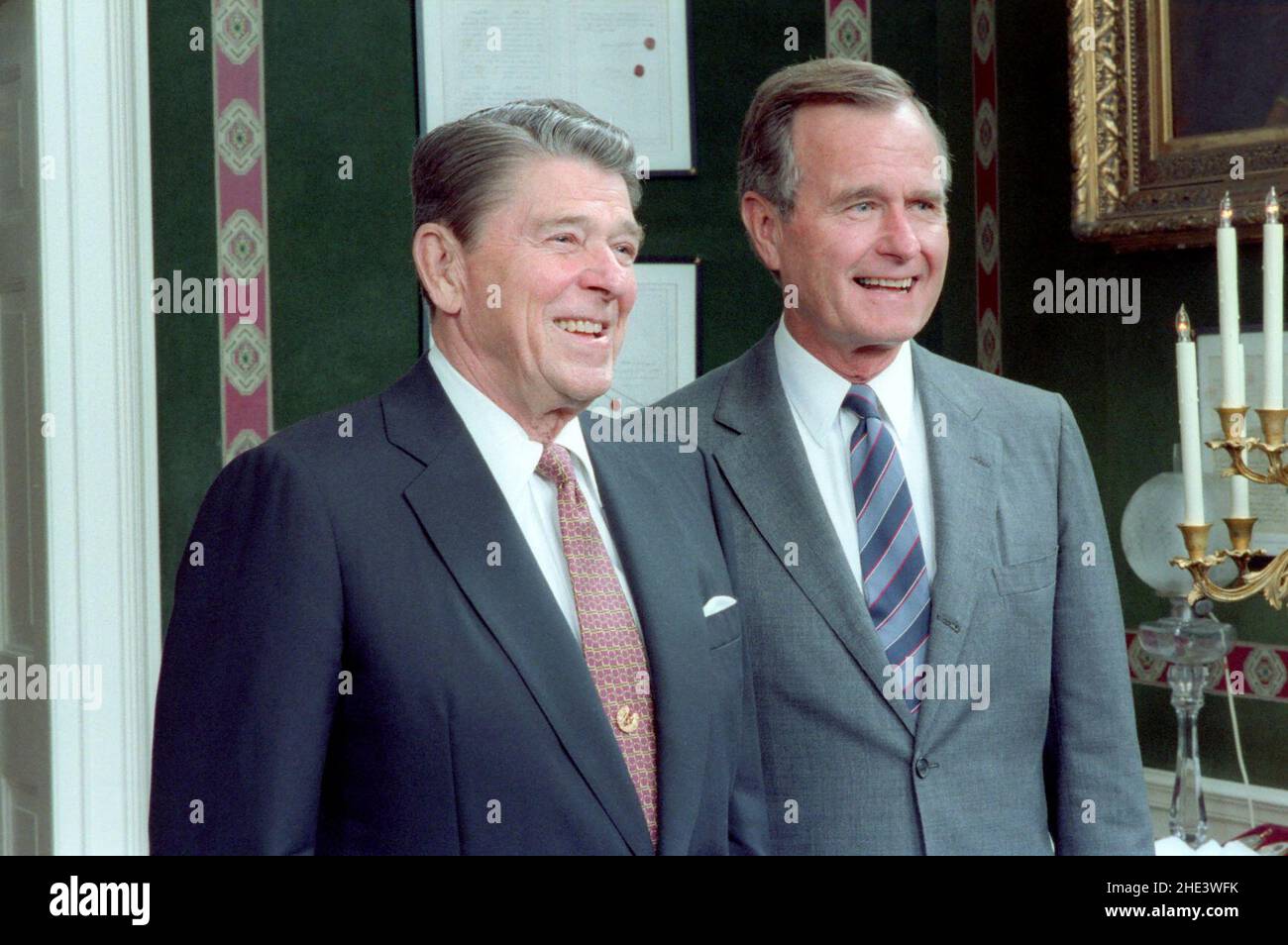Ronald Reagan and George H. W. Bush in The Treaty Room Posing for The 1987 Cabinet Photo. Stock Photo