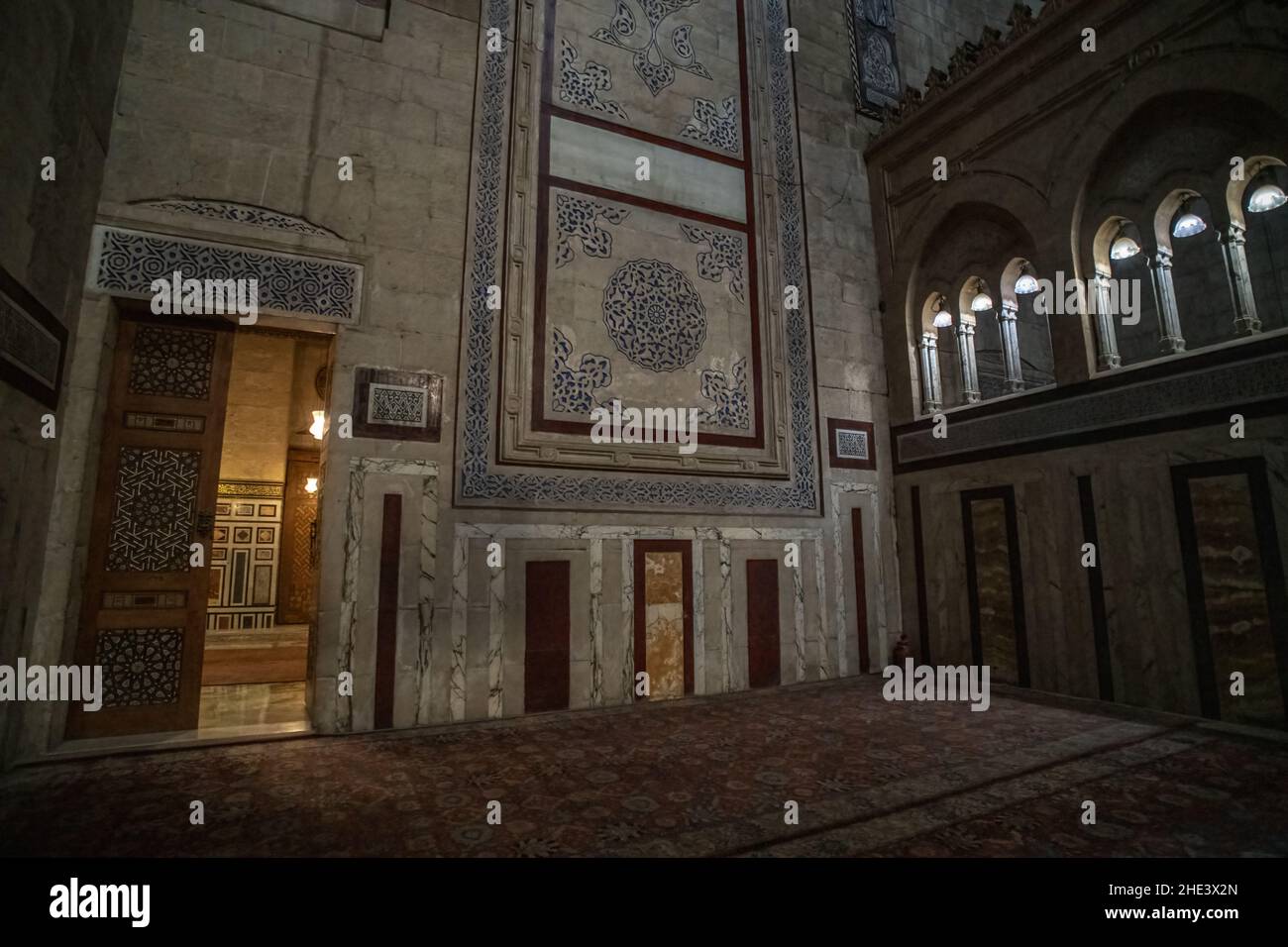 The lavish interior of the Al-Rifai mosque in Cairo Egypt, with marble walls and richly decorated doors. Stock Photo