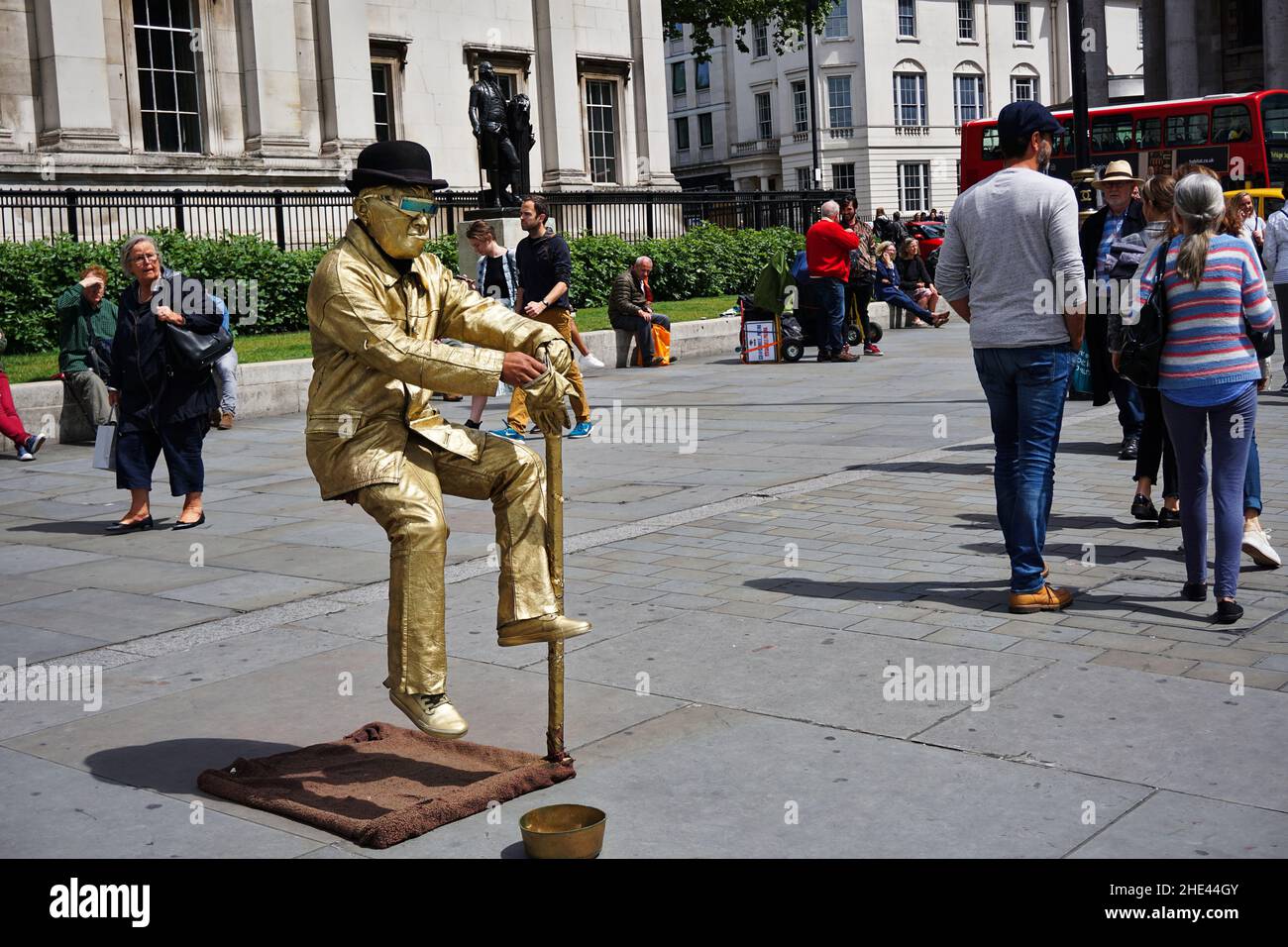 Street performer Golden man floating on air Stock Photo Alamy