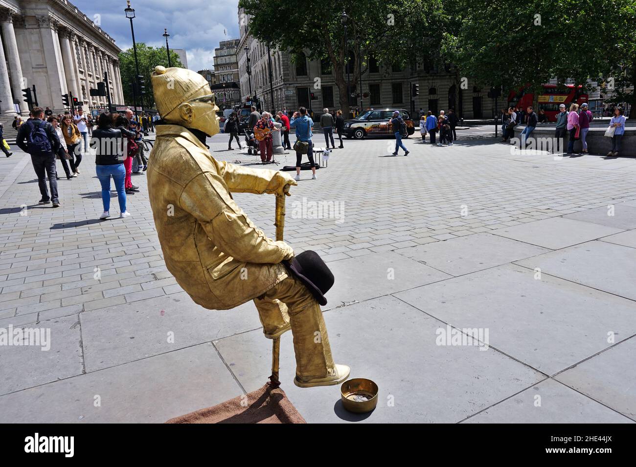 Street performer Golden man floating on air Stock Photo Alamy