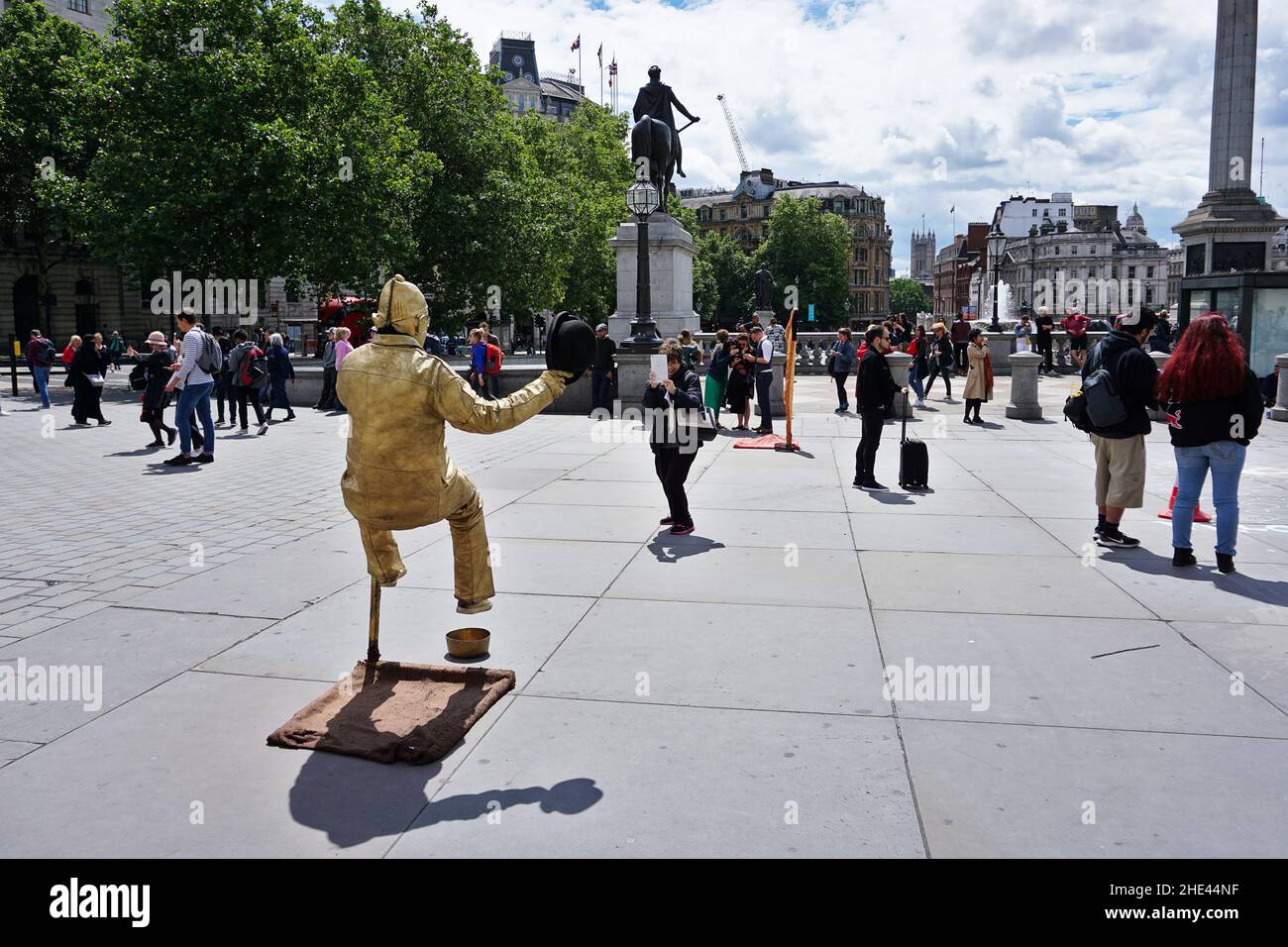 Street performer Golden man floating on air Stock Photo Alamy