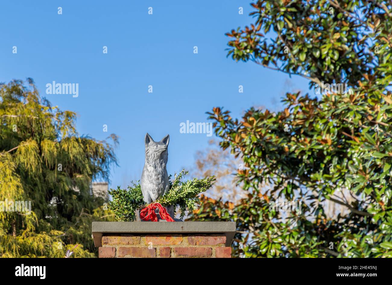 Statue of a dog decorated for Christmas Stock Photo