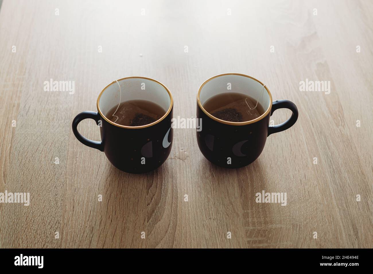 Two cups of tea on the wooden table Stock Photo