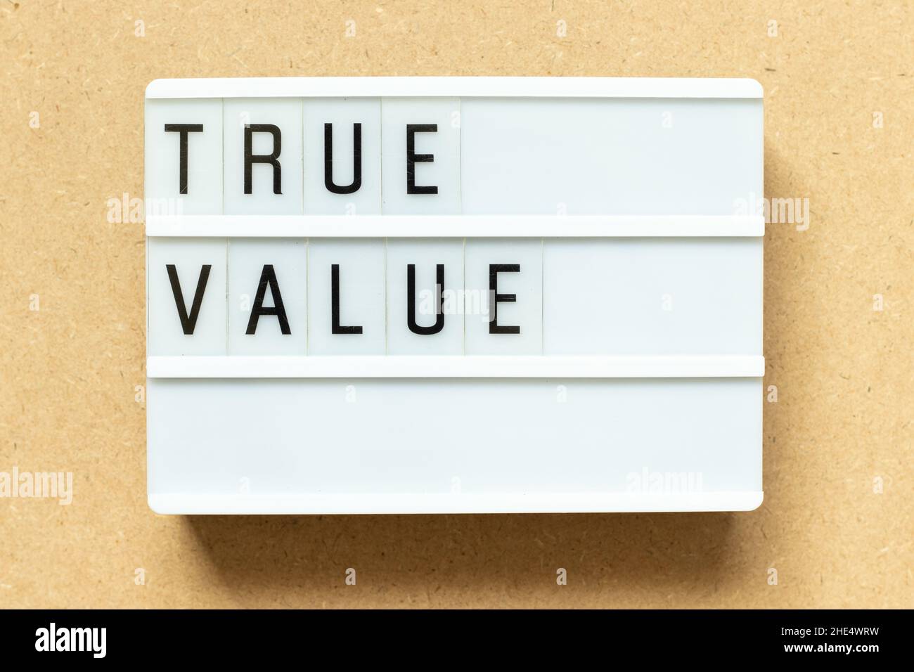 Lightbox with word true value on wood background Stock Photo