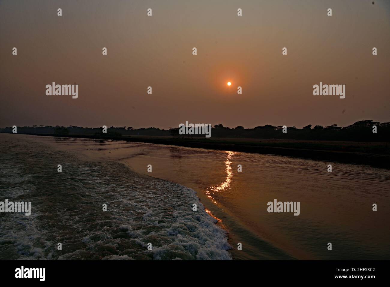 Rural Sunset over Meghna River - Bangladesh Stock Photo