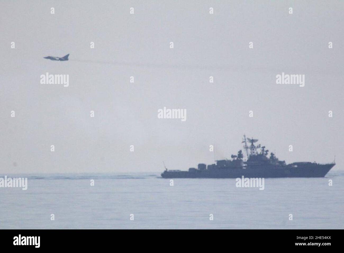 Russian Sukhoi Su-24 and Russian frigate Ladny. Stock Photo