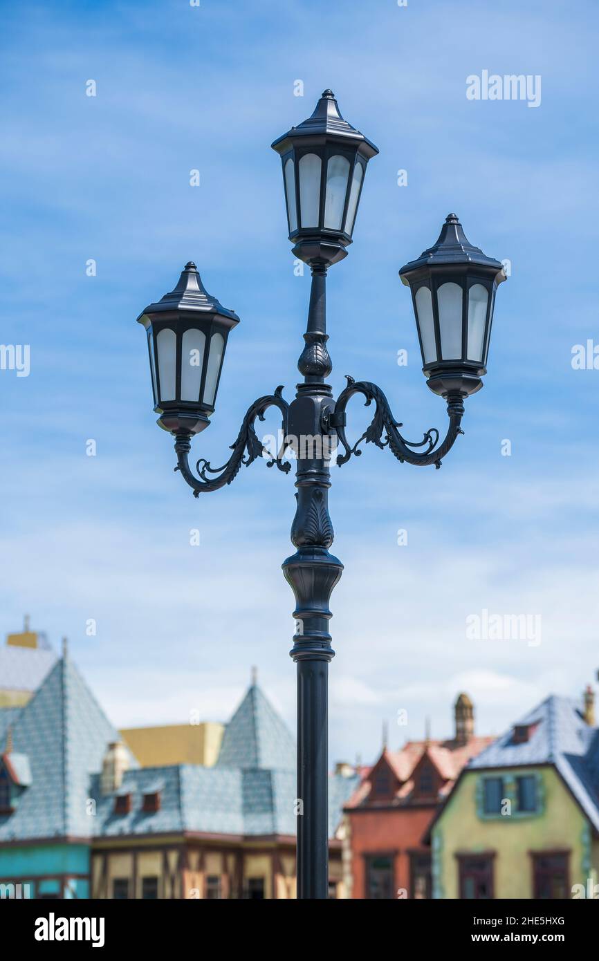 Street lamppost against the old buildings background on the island of