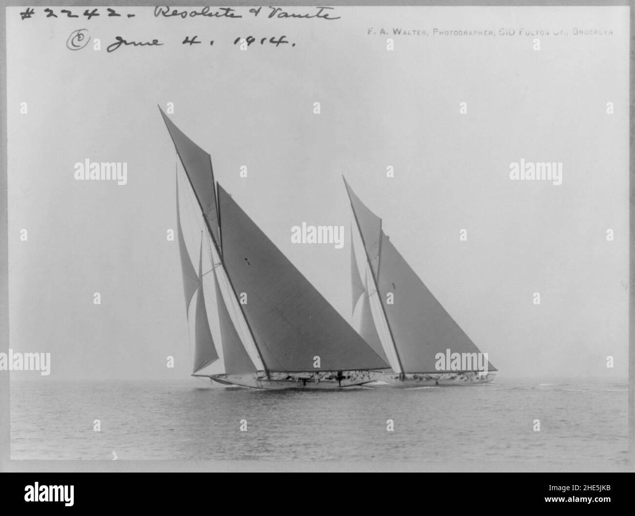 Sailing yachts on water RESOLUTE and VANITE tacking into the wind