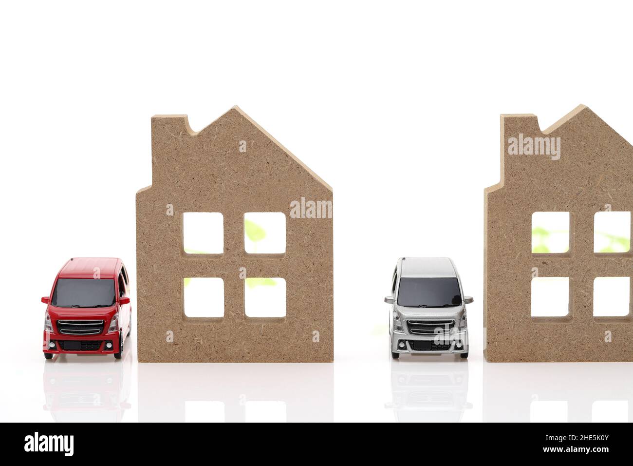 Wooden toy house and toy car isolated on white background Stock Photo ...