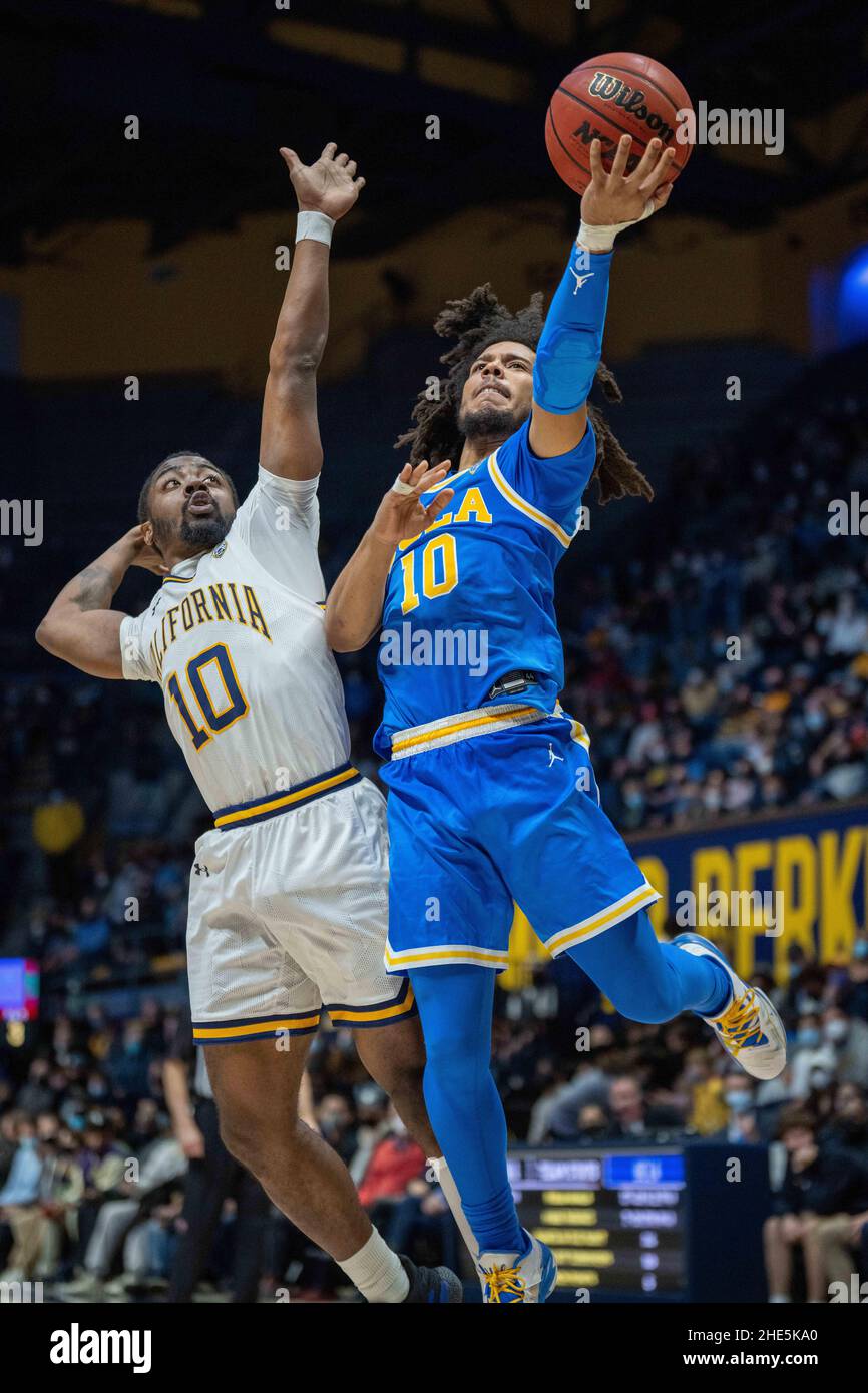UCLA guard Tyger Campbell (10) shoots a layup against California guard Makale Foreman (10) during the second half in Berkeley, California, Saturday De Stock Photo