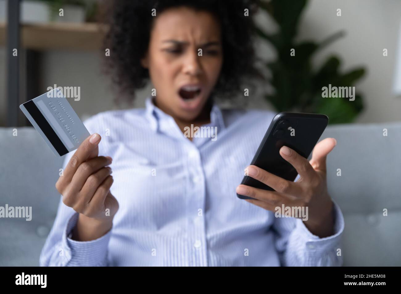 Unhappy young african american woman having problems with online shopping Stock Photo Alamy
