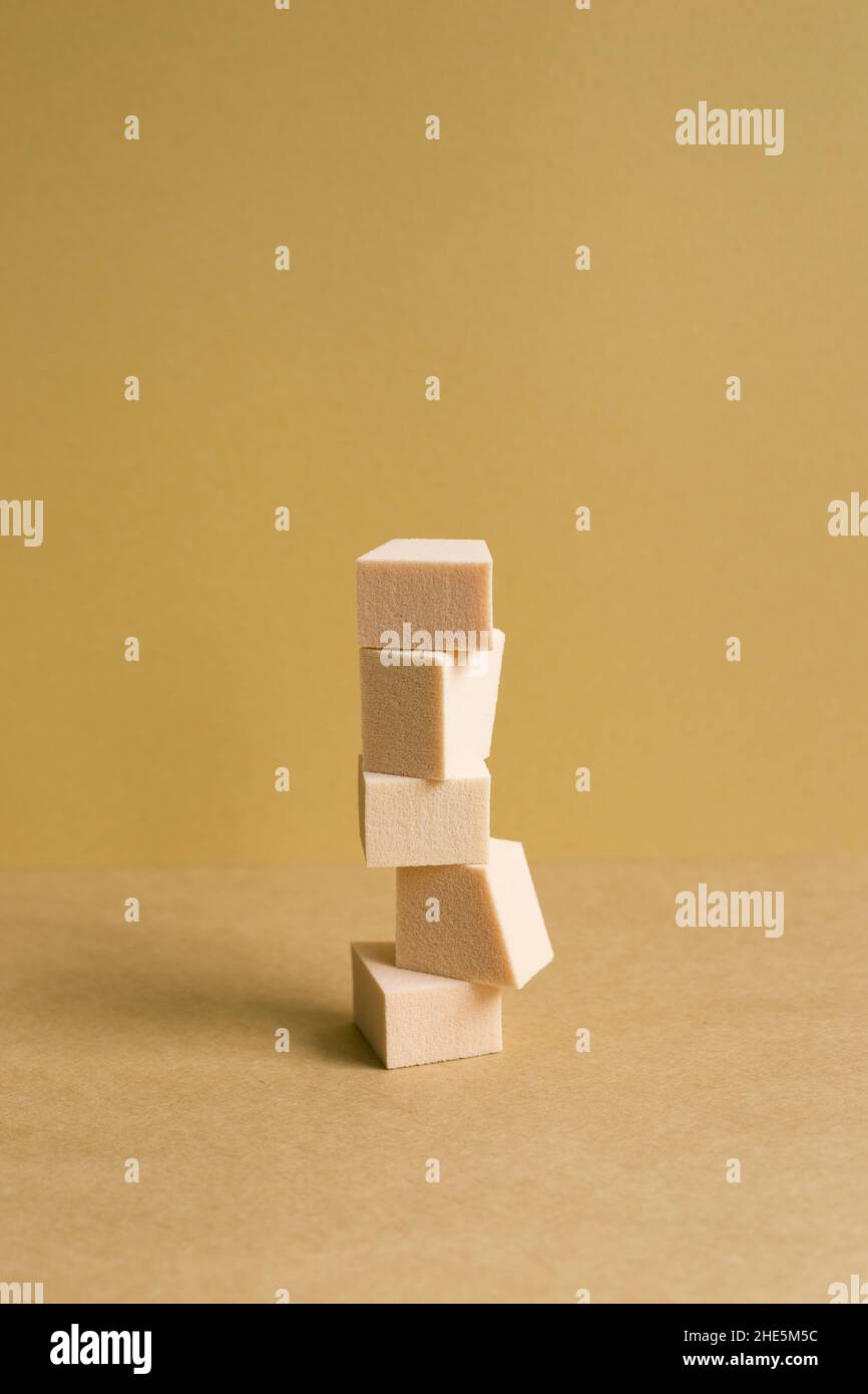 Stack of makeup sponge on brown table background Stock Photo