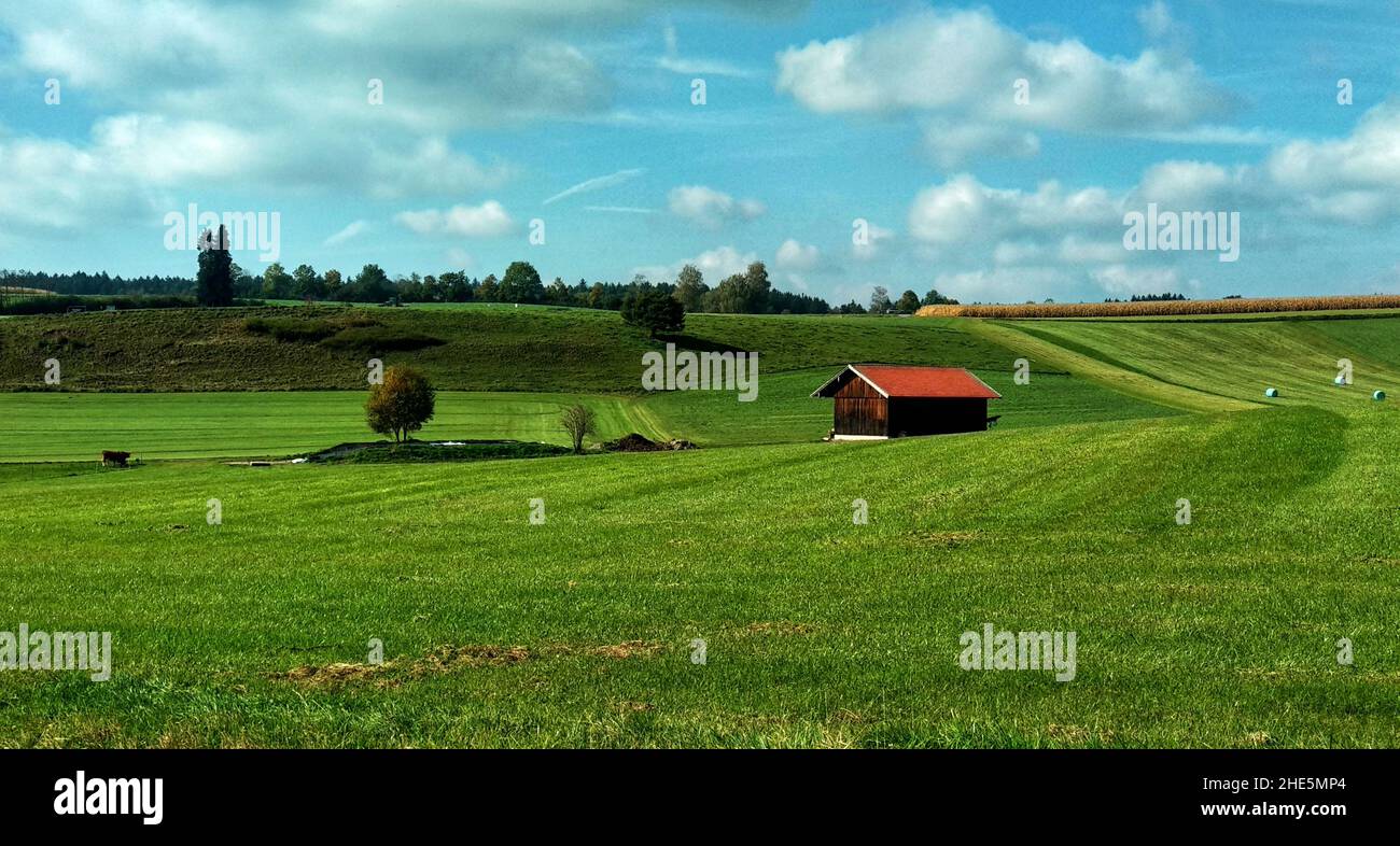 Agricultural field with a barn under a cloudy sky Stock Photo - Alamy