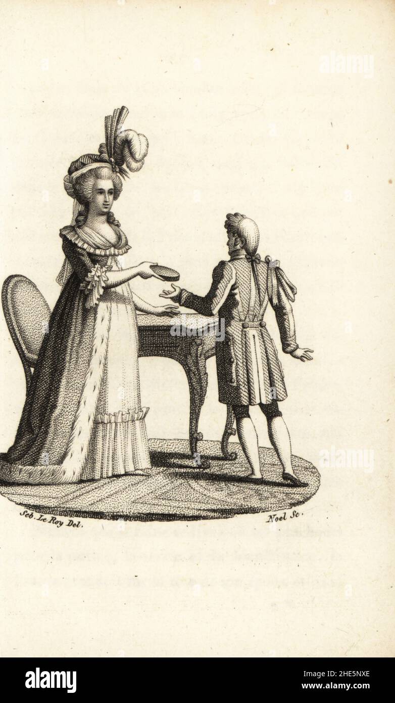 Marie Antoinette handing a servant an oval portrait of herself for Madame de Lamballe. It was signed, Ses mahleurs l'ont blanchie, misfortunes made me grey. (Her hair went grey in her early 30s). Stipple copperplate engraving by Noel after an illustration by Sebastien Leroy from Marie Antoinette, Archiduchesse d'Autriche, Reine de France, chez le Fuel, Paris,  1815. Stock Photo