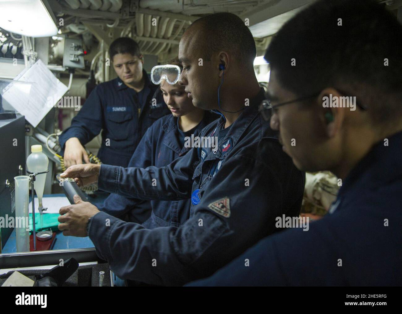 Sailors test JP5 fuel aboard USS Mustin. (10193544993 Stock Photo Alamy
