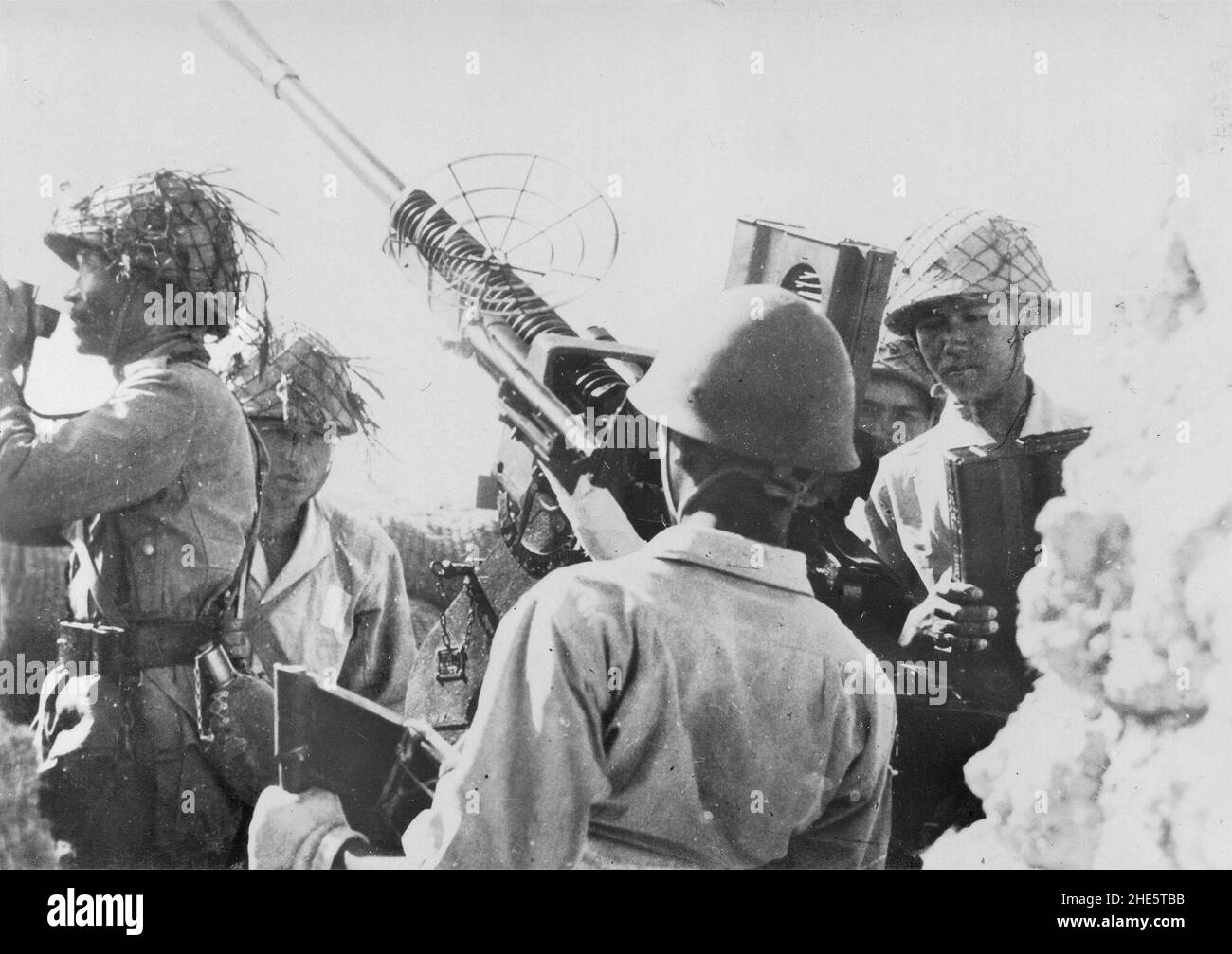 Pacific War, 1941-1945. Imperial Japanese Navy Air Defense troops man a Type 96 25mm anti-aircraft automatic cannon in the South Pacific, 1944. Stock Photo