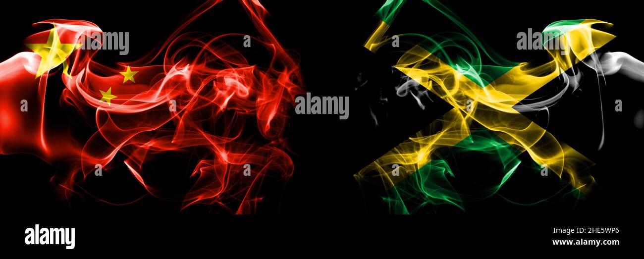 Flags of China, Chinese vs Jamaica, Jamaican. Smoke flag placed side by side on black background. Stock Photo