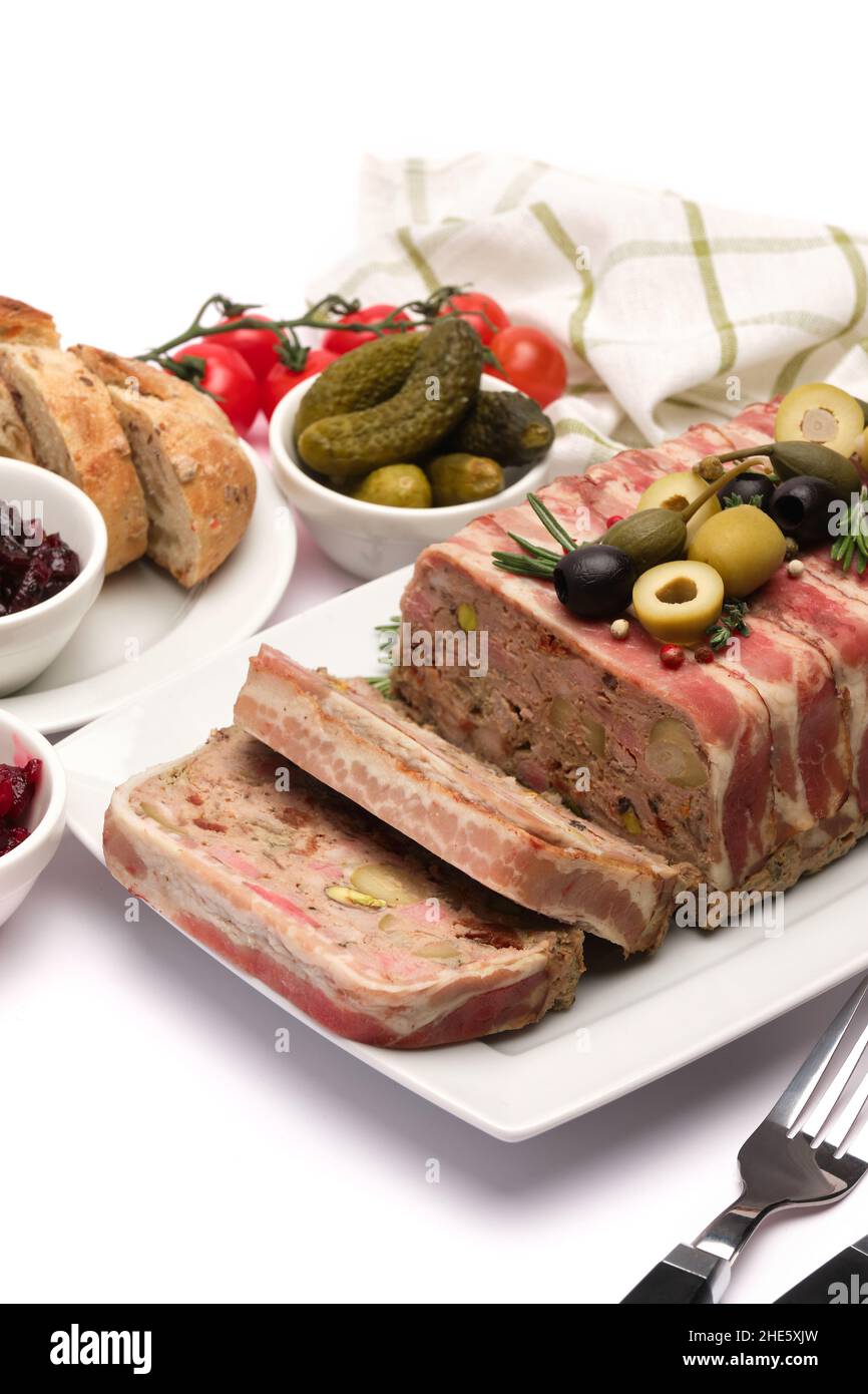 Traditional French terrine covered with bacon isolated on white