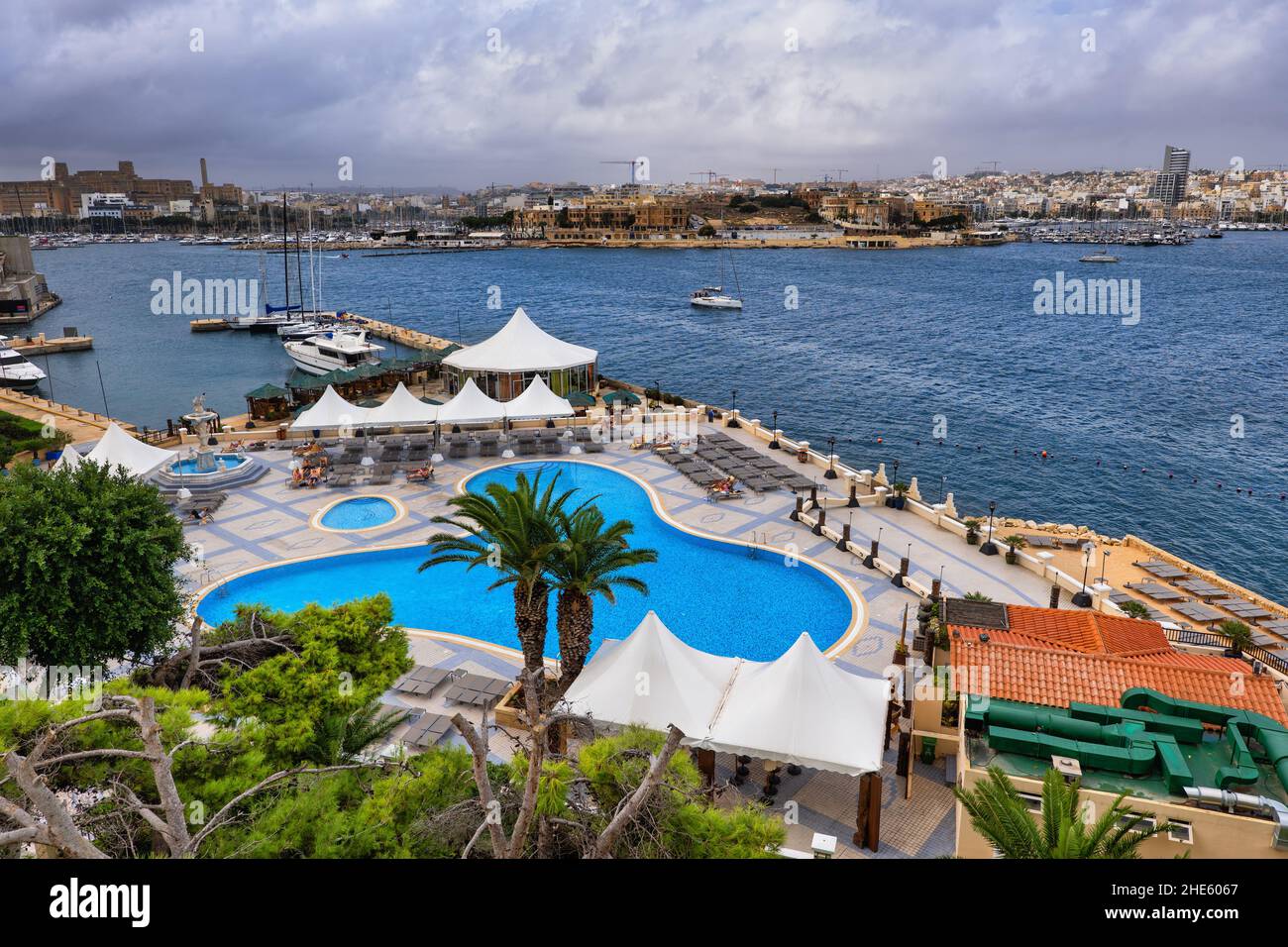 Swimming pool and seaside terrace of Grand Hotel Excelsior in Valletta, Malta, 5-star luxury accommodation at the Marsamxett Harbour. Stock Photo
