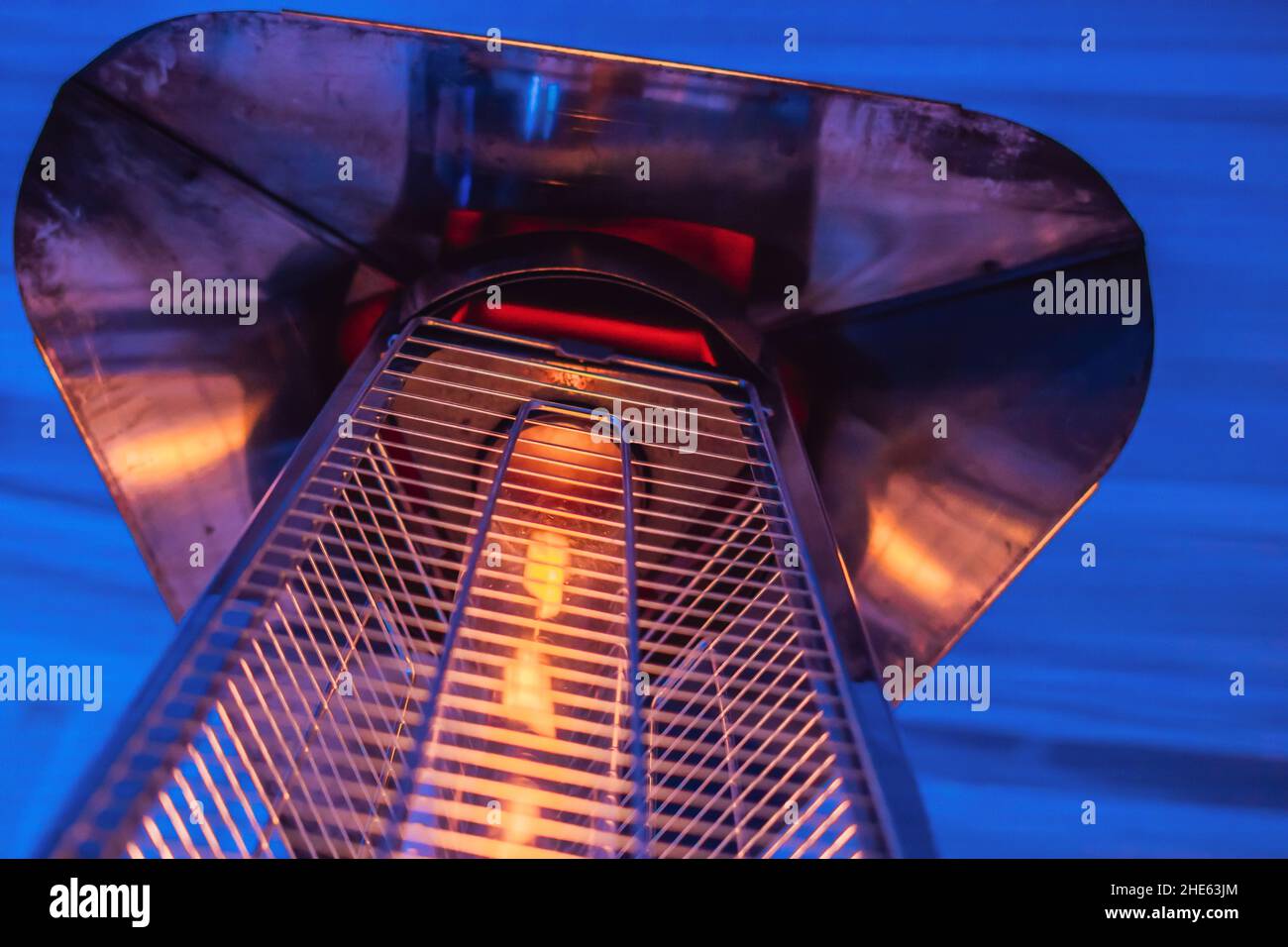 heating lamp heater placed among the tables of an open cafe Stock Photo