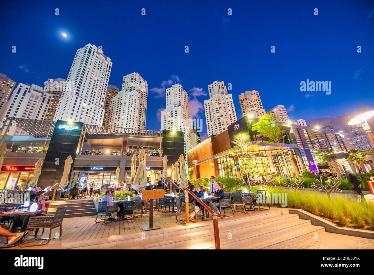 DUBAI, UAE - DECEMBER 10, 2016: Dubai Marina skyscrapers at night from city beach Stock Photo
