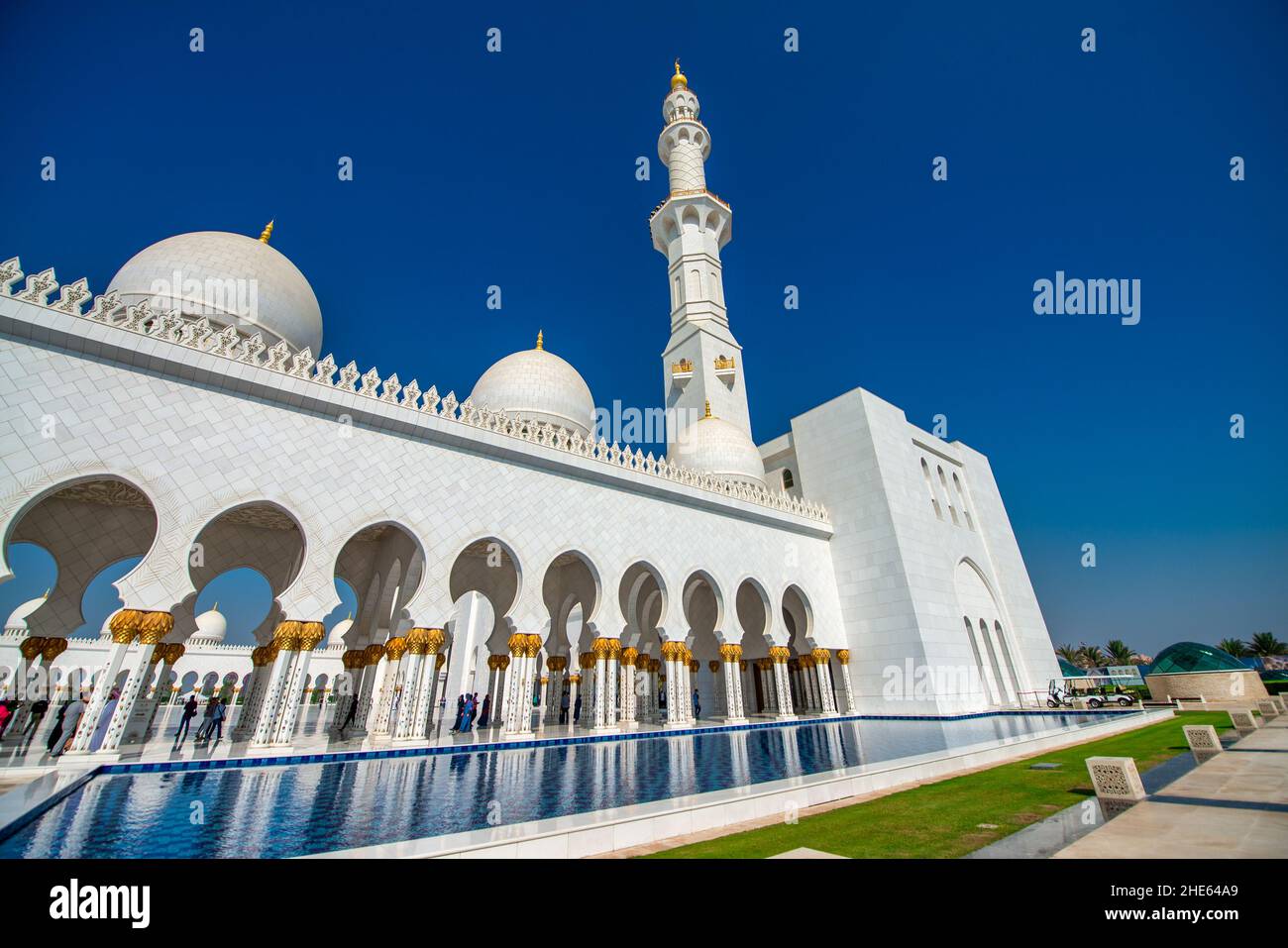 ABU DHABI, UAE - DECEMBER 7, 2016: Islamic and Catholic tourists visit Sheikh Zayed Mosque.It is a major city attraction Stock Photo