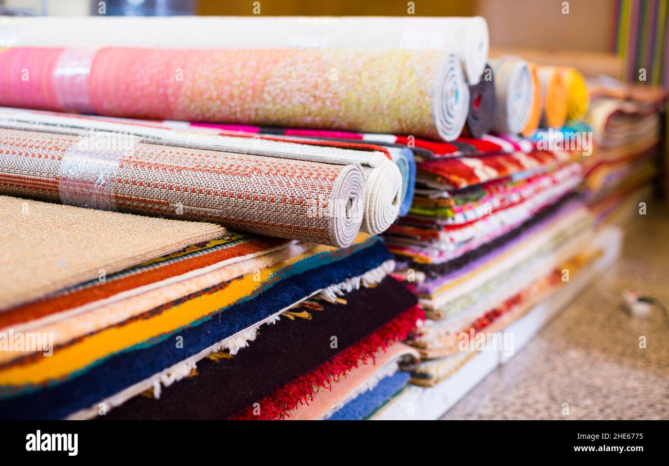 Assortment of colour carpets in the store Stock Photo Alamy