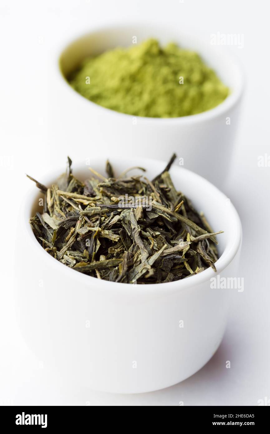 Dry green tea leaves and matcha ea Stock Photo