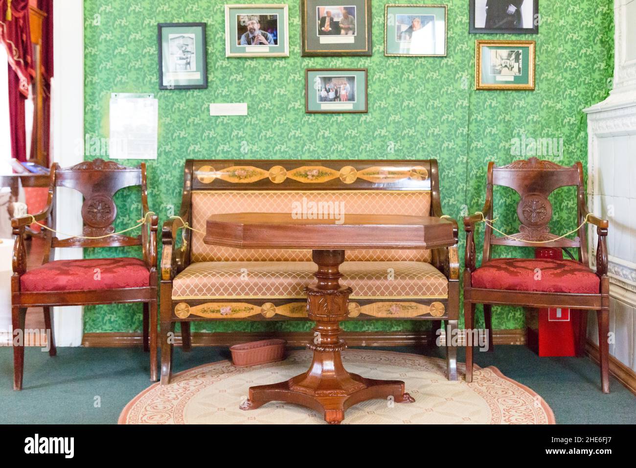 Irkutsk, Russia July 30, 2021 - House of the Decembrist Trubetskoy Sergei Petrovich. Furniture on the background of the wall with portraits Stock Photo