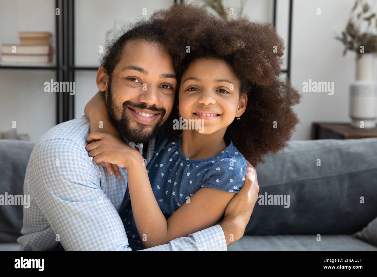 happy-afro-american-dad-hugging-cute-pre-teen-daughter-stock-photo-alamy