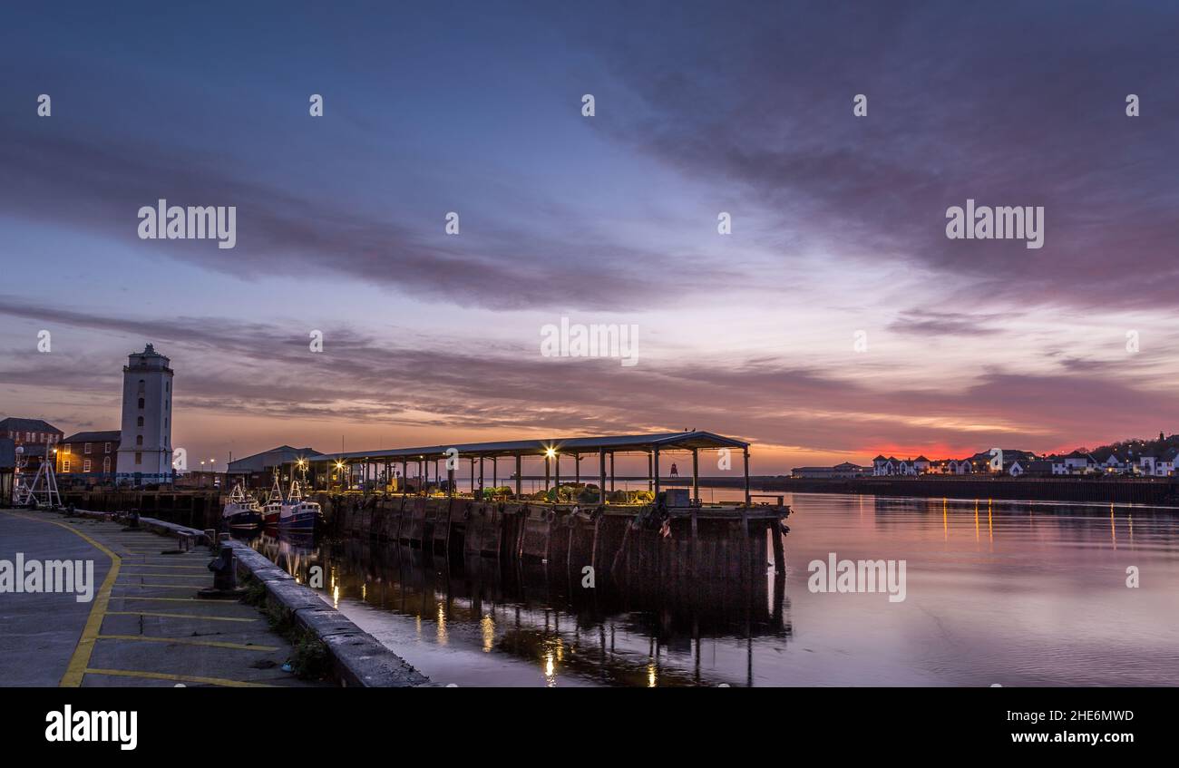 North Shields Fish Quay on a calm morning during a vivid sunrise Stock Photo