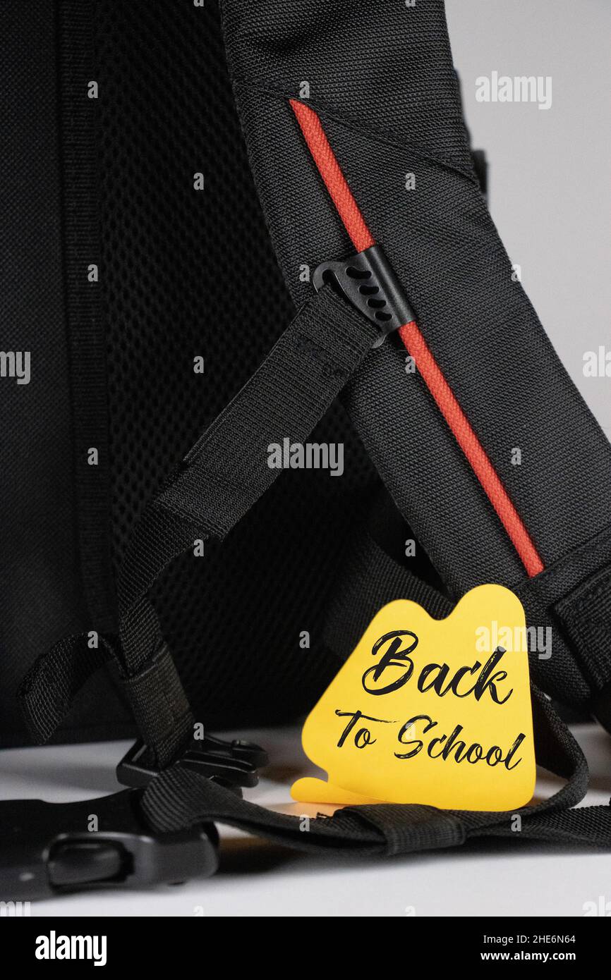 Back to school - the inscription on the sticker with school backpacks Stock Photo