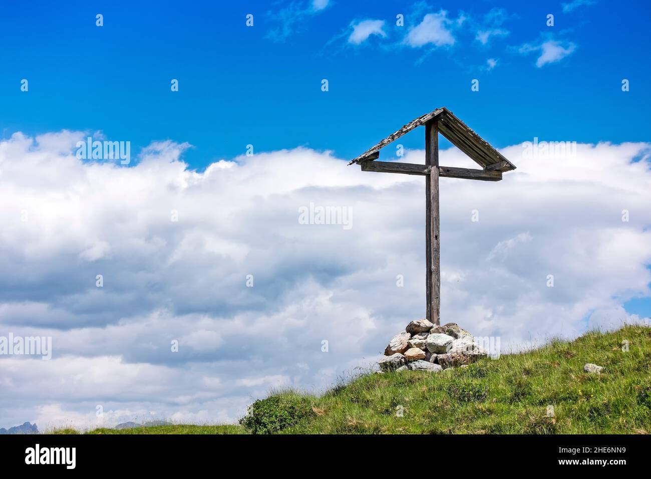 Wooden cross on top of mountain, blue sky, tranquil scene, Austrian alps Stock Photo