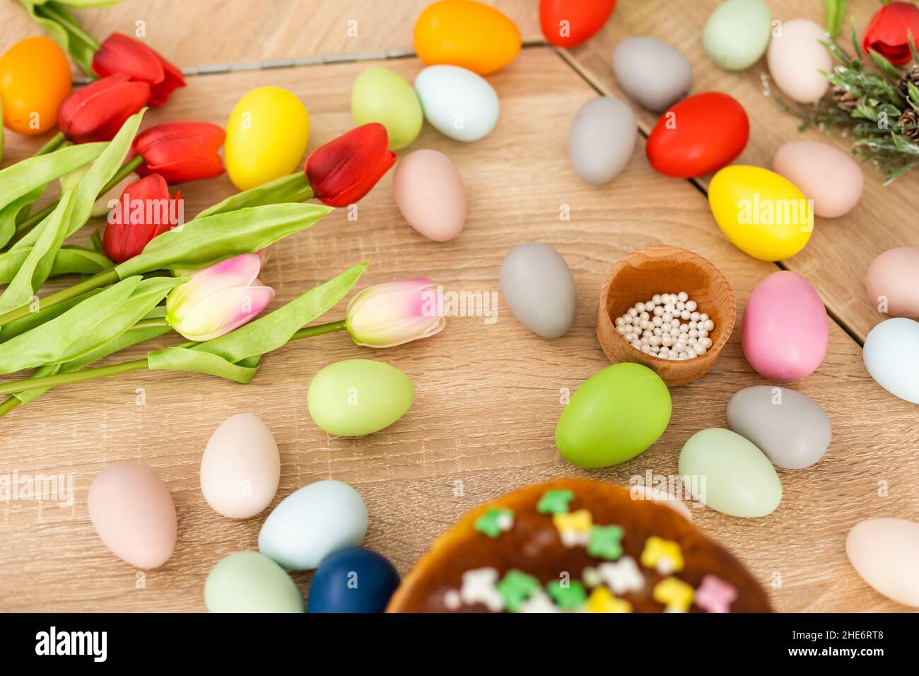 Easter cake and colorful eggs on festive Easter table Stock Photo