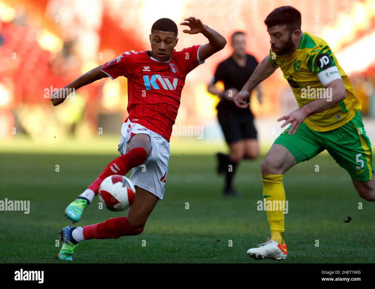 Charlton Athletic's Mason Burstow (left) and Norwich City's Grant Hanley battle for the ball during the Emirates FA Cup third round match at The Valley, London. Picture date: Sunday January 9, 2022. Stock Photo