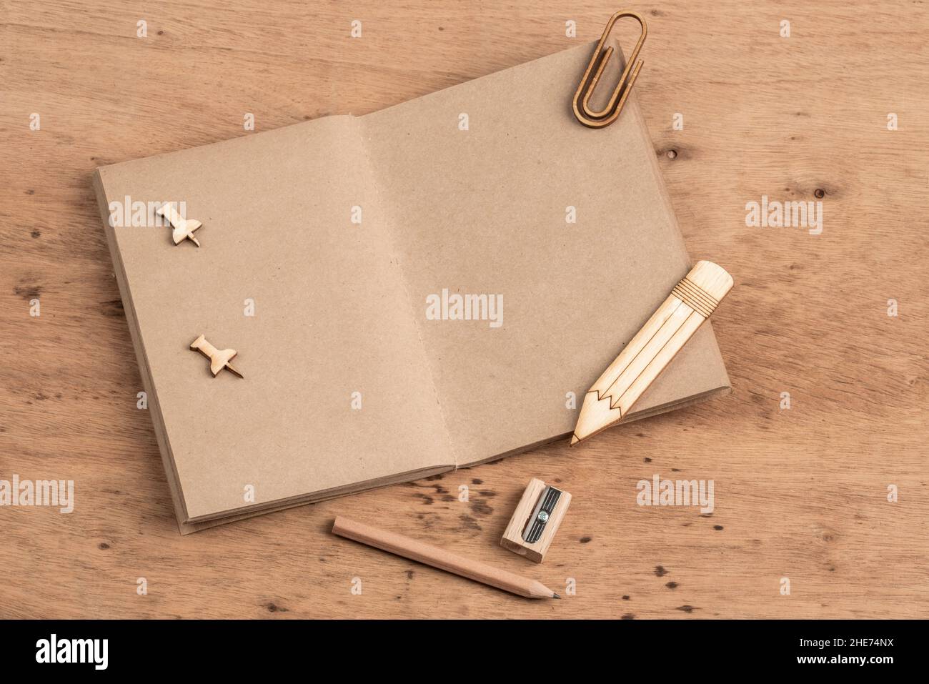 a blank notebook opened on a wooden table with copy space Stock Photo