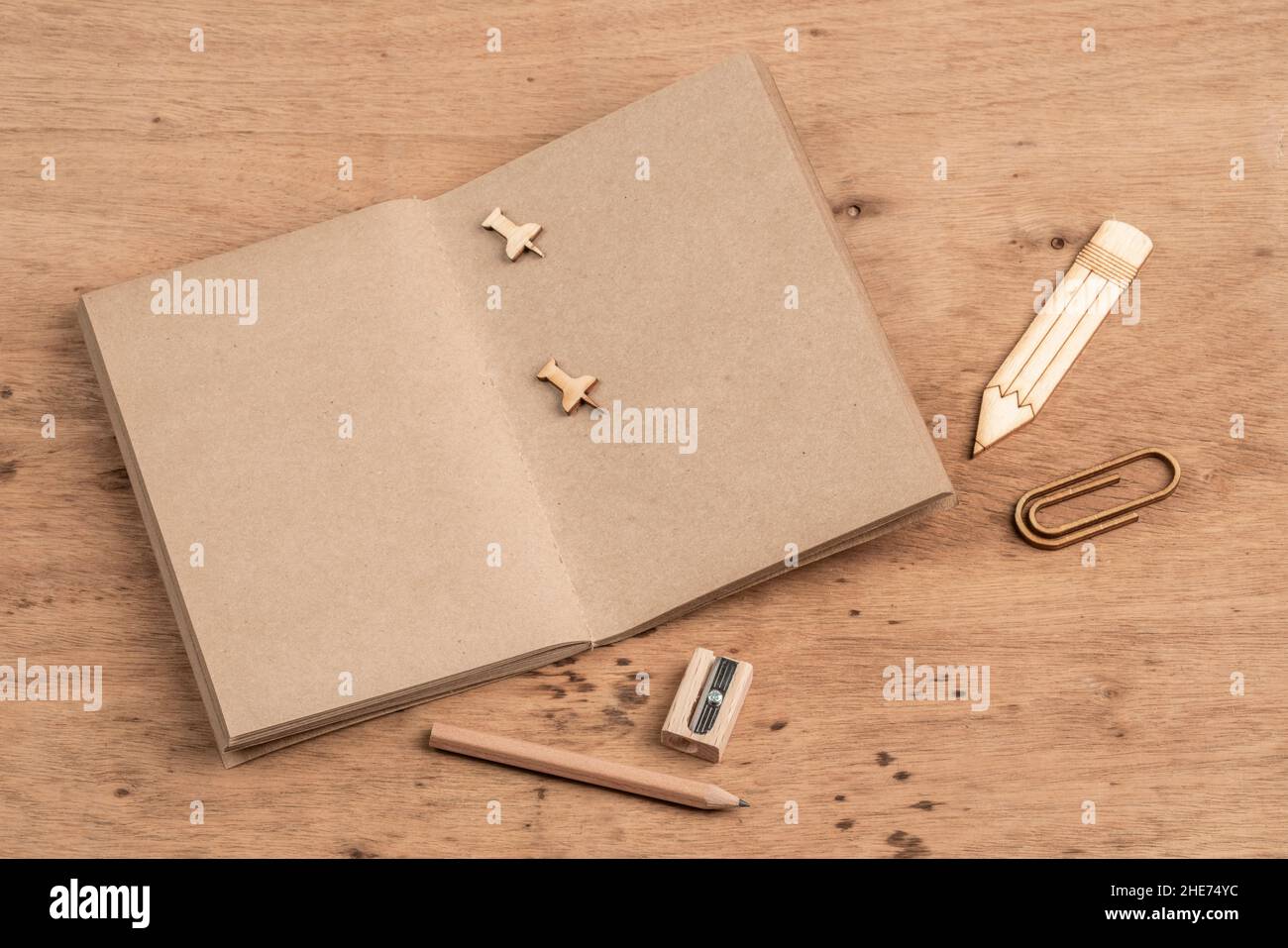 a blank notebook opened on a wooden table with copy space Stock Photo