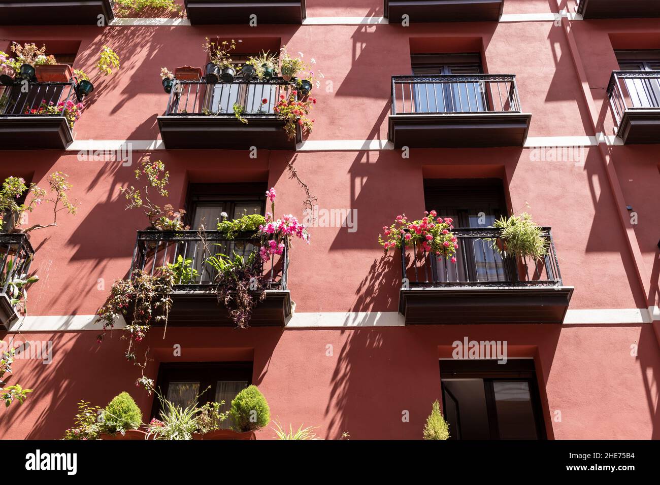 old facade in bilbao painted red Stock Photo - Alamy