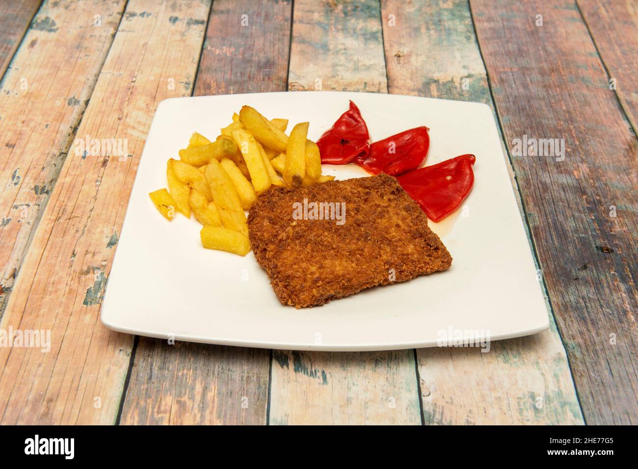 cordon bleu made from thinly mashed meat and wrapped around a slice of ham and a slice of cheese, breaded and then fried or baked. Stock Photo