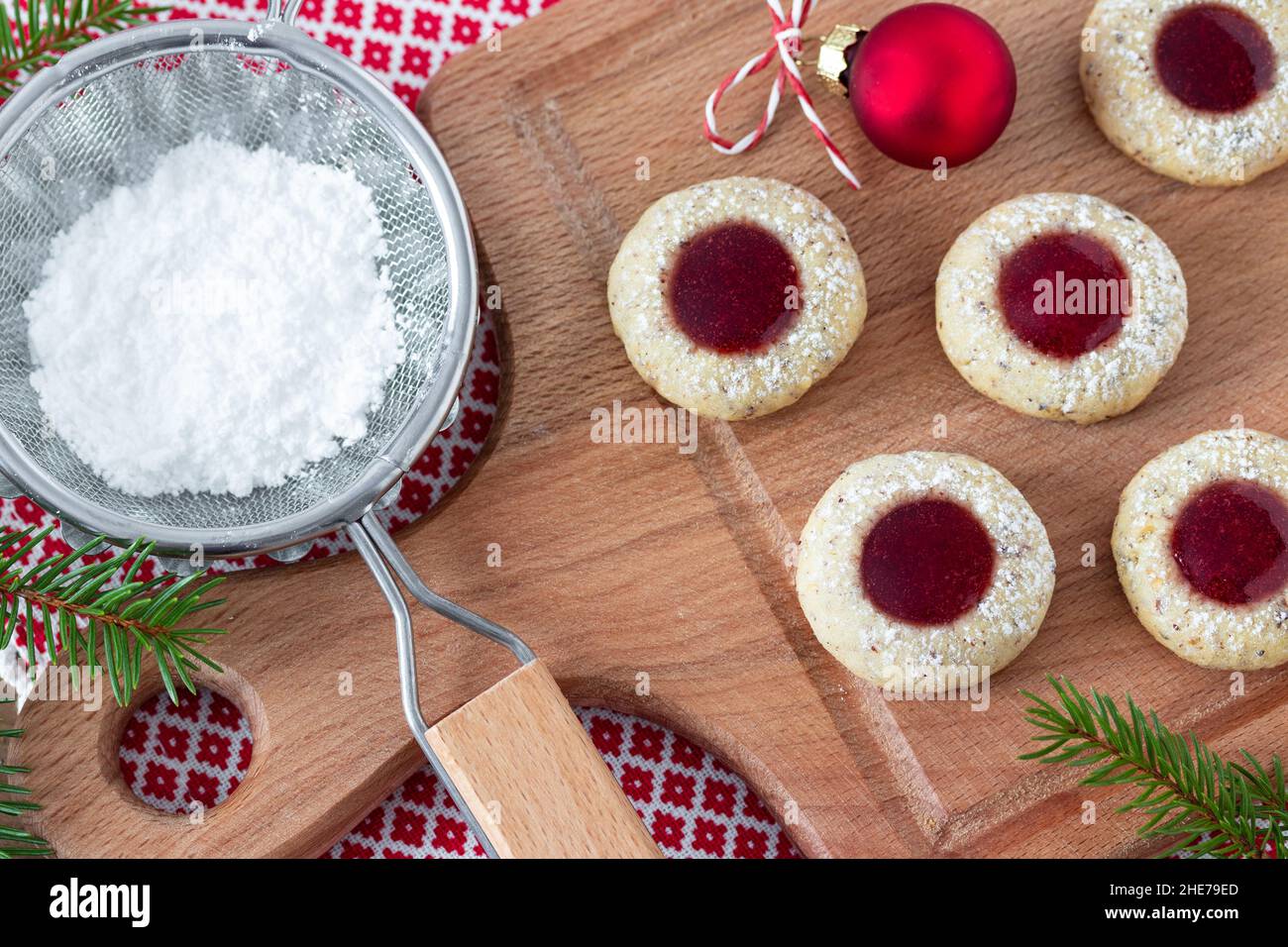 christmas biscuits Husarenkrapfen on wooden board Stock Photo